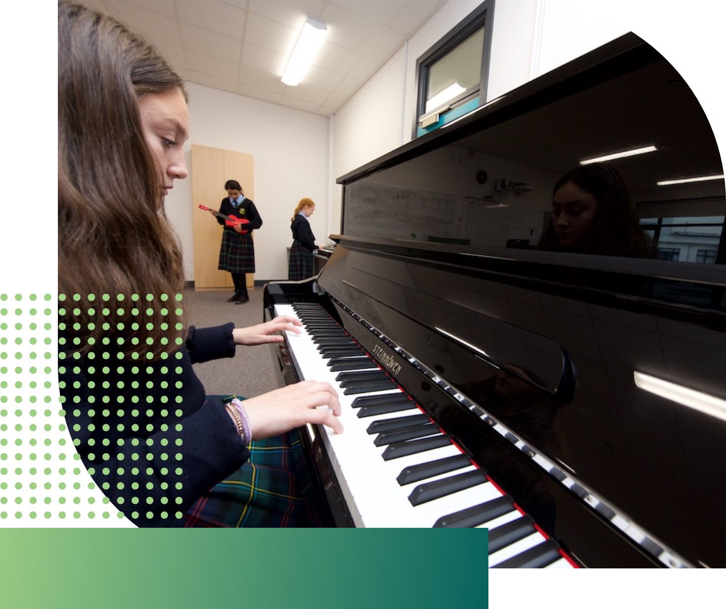 girl playing piano in classroom